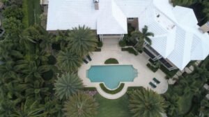 Exterior, an aerial view of a luxury house with a pool, for “The Top 3 Alternative Investments for Accredited Investors”