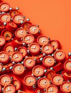 Hundreds of red alarm clocks tumble over each other, for “How to Strengthen Your Portfolio with Alternative Assets in Volatile Times”